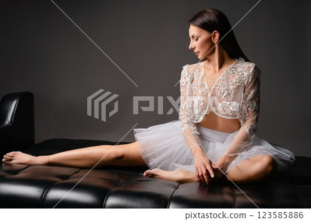 Fitness model showcases stylish lingerie in a sport-inspired setting Fitness model showcases stylish lingerie in a sport-inspired setting 123585886