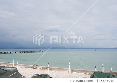 Beautiful aerial view of Garda Lake, wooden pier. No people Beautiful aerial view of Garda Lake, wooden pier. No people 123585950