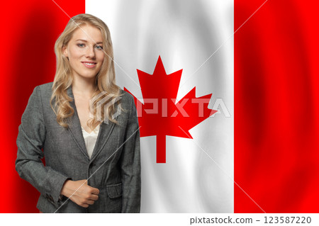 Blond happy woman with flag of Canada 123587220