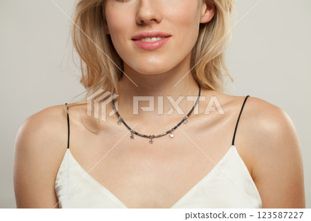 Fashion jewelry necklace on beautiful female neck 123587227