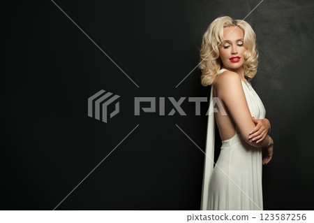 Glorious young female model fashion beauty portrait. Elegant woman with long blond curly hairstyle  123587256