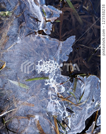 Frozen Lake Surface with Cracked Ice Patterns Frozen Lake Surface with Cracked Ice Patterns 123588238