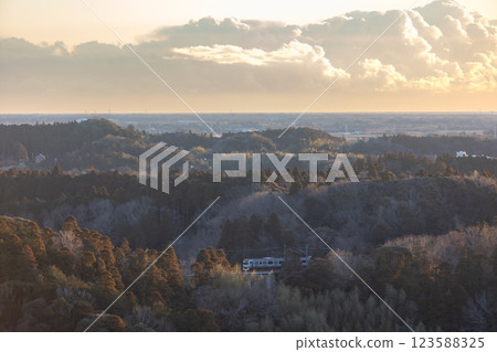 E217 series train running through the mountains as the sun rises E217 series train running through the mountains as the sun rises 123588325