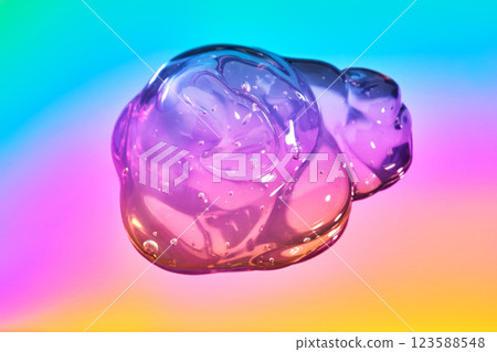 The texture of the cosmetic gel on a multicolored background. 123588548