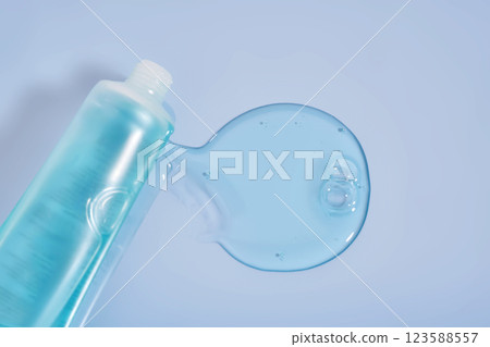 Shampoo pouring out of a small tube on a blue background. Texture. Shampoo pouring out of a small tube on a blue background. Texture. 123588557