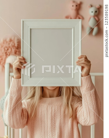 Girl Holding Empty Frame in Pastel Room Photography Indoor Portrait Creativity 123589198