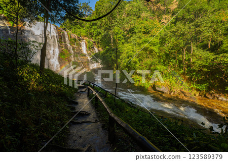 There's a waterfall trail with rainbows There's a waterfall trail with rainbows 123589379