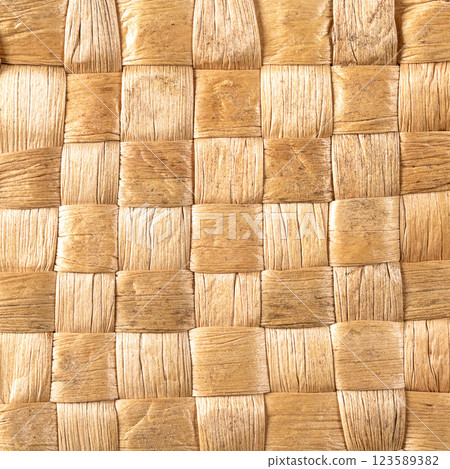 Intricate reed straw weave background texture in stunning close-up 123589382