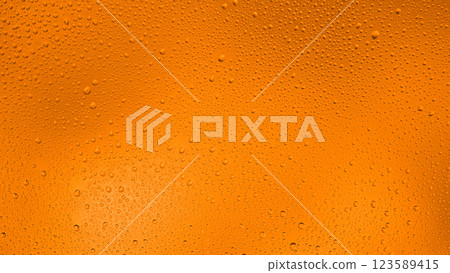 Glowing gradient orange background with contrasting water drops 123589415