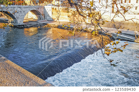 Rome,cityscape.Small waterfall on the Tiber river.Toned photo 123589430