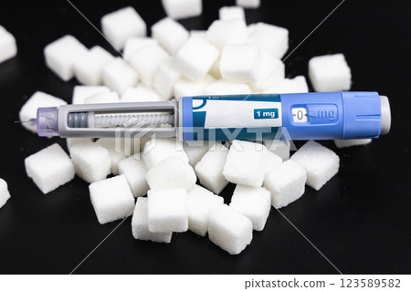 Ozempic Insulin injection pen on a dark background for diabetics and weight loss. 123589582