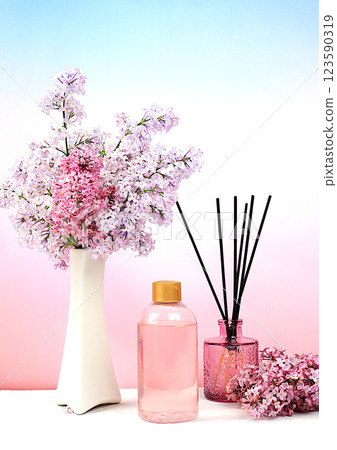 Advertising postcard of spa salon. Wellness composition with lilac water, pink salt, aromatic sticks and fresh lilac flowers, Concept of natural self-care and healthy lifestyle, abstract composition 123590319