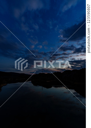 The temperature is rising and it's starting to feel like spring at Nara Nunome Dam. Clouds floating in the sky during a beautiful blue moment. The temperature is rising and it's starting to feel like spring at Nara Nunome Dam. Clouds floating in the sky during a beautiful blue moment. 123590807