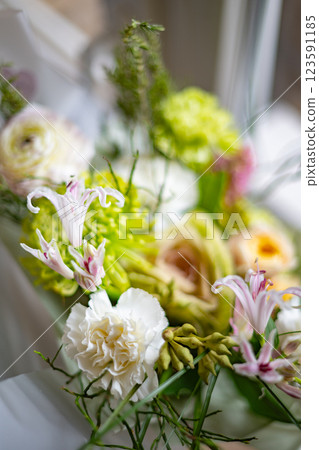 Vibrant Floral Arrangement Featuring a Variety of Colorful Blooms Vibrant Floral Arrangement Featuring a Variety of Colorful Blooms 123591185
