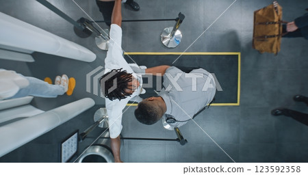 Diverse People Passing Through X-ray Metal Detector Scanner, Airport Worker Checking Passengers 123592358
