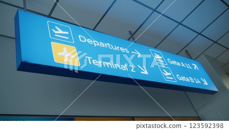 Blue Navigation Sign Directing Passengers to Departures, Terminals And Gates Blue Navigation Sign Directing Passengers to Departures, Terminals And Gates 123592398