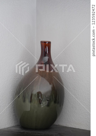 beautiful gradient red and green ceramic vase on wooden floor, white room wall corner background, object, decor, fashion, ancient, copy space beautiful gradient red and green ceramic vase on wooden floor, white room wall corner background, object, decor, fashion, ancient, copy space 123592472