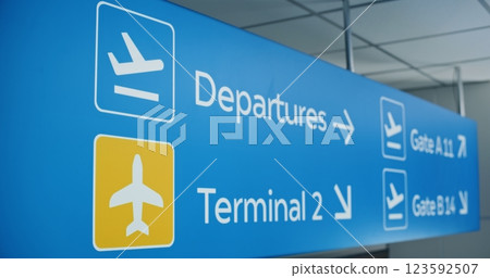 Blue Navigation Sign Directing Passengers to Departures, Terminals And Gates 123592507