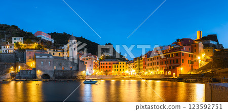 Panoramic view on fishing village Vernazza with glowing multicolored houses Panoramic view on fishing village Vernazza with glowing multicolored houses 123592751