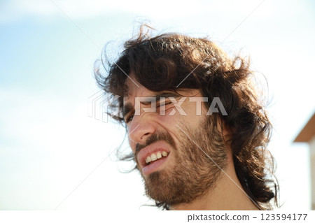 Kind Man Makes A Slight Smile Outside To His Girlfriend Kind Man Makes A Slight Smile Outside To His Girlfriend 123594177
