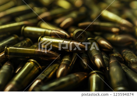 Big amount of pistol and rifle new bullets in pile. Neural network ai generated 123594874