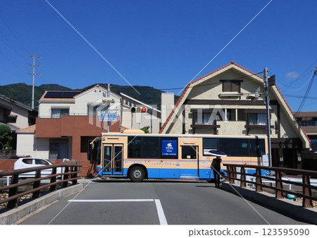 Hankyu bus running near Sakasegawa River in Takarazuka City 123595090