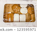 Closed box full of a donut variety  123595971