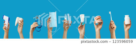 Medical accessories, set of hands with medical accessories on blue background 123596059