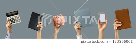 Business accessories, set of hands with business accessories on gray background 123596061