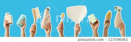 House cleaning accessories, set of hands with house cleaning accessories on blue background 123596062