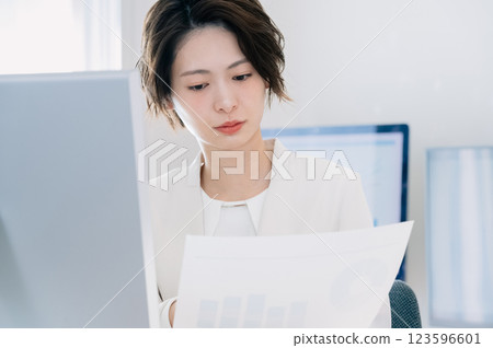Business woman thinking in the office Business woman thinking in the office 123596601