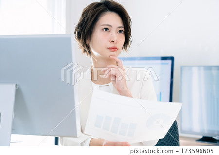 Business woman thinking in the office 123596605