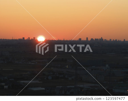 First sunrise in Kawagoe and a distant view of Saitama's subcenter, Kawagoe City, Saitama Prefecture (aerial photography by drone) 123597477