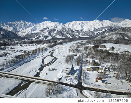 Beautiful view of the Hakuba mountain range and Matsukawa River, Hakuba Village, Nagano Prefecture (aerial shot by drone) 123597496