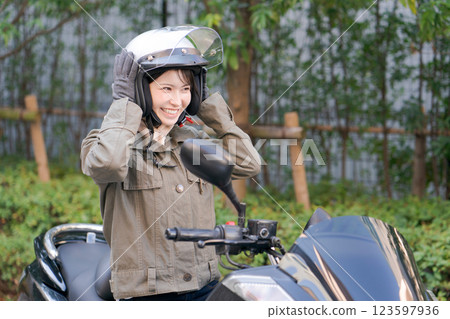  Woman riding a bike 123597936