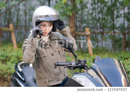  Woman riding a bike 123597937