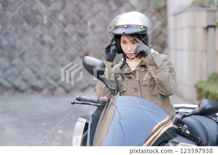  Woman riding a bike 123597938