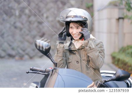  Woman riding a bike 123597939