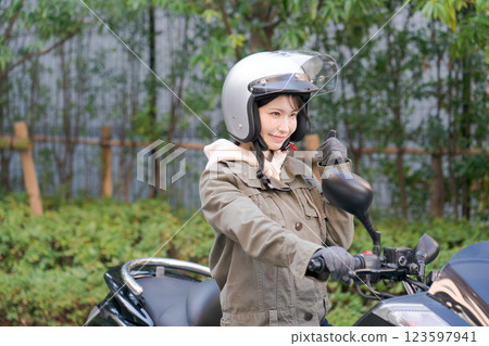 Woman riding a bike 123597941