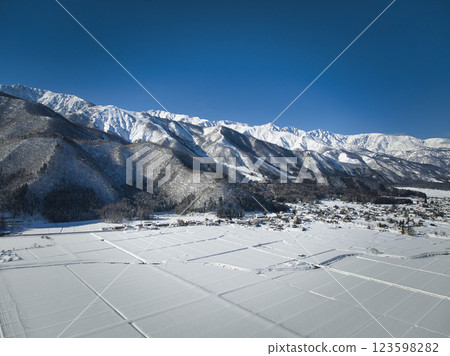 A magnificent view of the Hakuba mountain range from Horinouchi, Hakuba Village, Nagano Prefecture (aerial shot by drone) A magnificent view of the Hakuba mountain range from Horinouchi, Hakuba Village, Nagano Prefecture (aerial shot by drone) 123598282