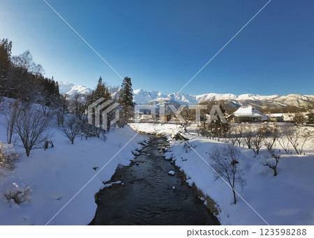 Oide Suspension Bridge and the Hakuba Sanzan mountains, Hakuba Village, Nagano Prefecture (aerial photography by drone) 123598288