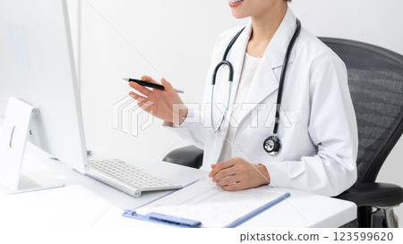 Image of a female doctor examining a patient Image of a female doctor examining a patient 123599620