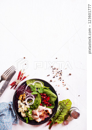 beet salad with nuts bacon and cheese 123601777