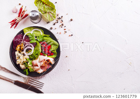 beet salad with nuts bacon and cheese 123601779