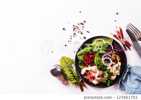 beet salad with nuts bacon and cheese 123601781