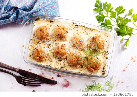 Baked meatballs with spices and white sauce 123601793