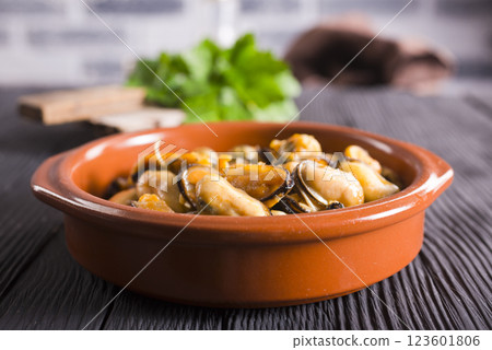 Fried mussels. grilled seafood close up. cooking process Fried mussels. grilled seafood close up. cooking process 123601806