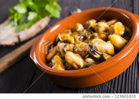 Fried mussels. grilled seafood close up. cooking process Fried mussels. grilled seafood close up. cooking process 123601810