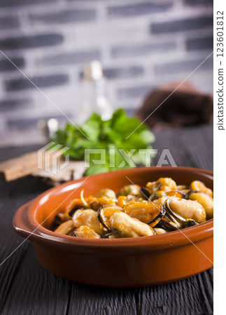 Fried mussels. grilled seafood close up. cooking process Fried mussels. grilled seafood close up. cooking process 123601812