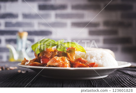 Chicken meat with mushroom sauce on a rice pad. 123601828